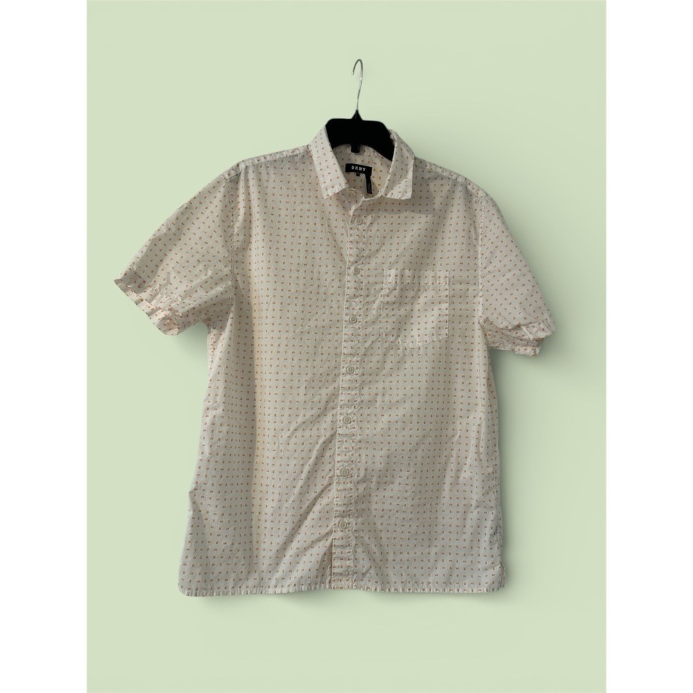 This is a DKNY white and orange printed button-down shirt.